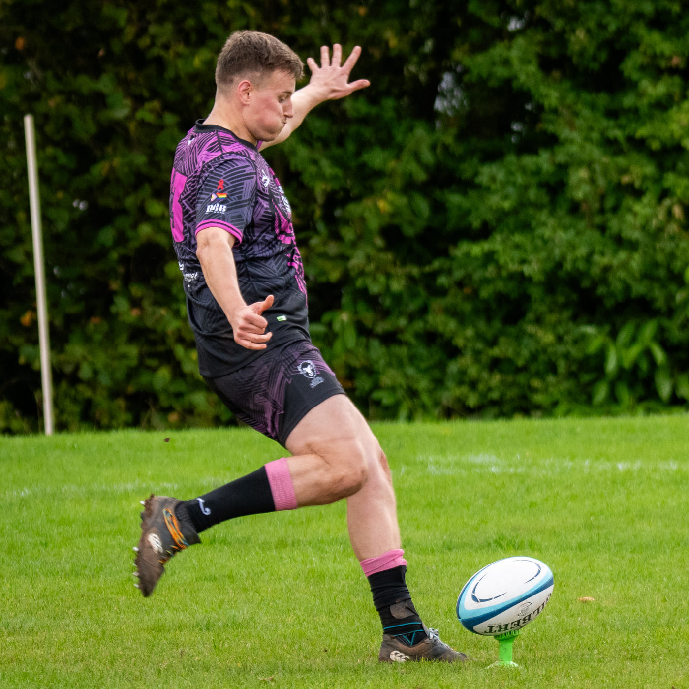 Bisons RFC Player kicking ball